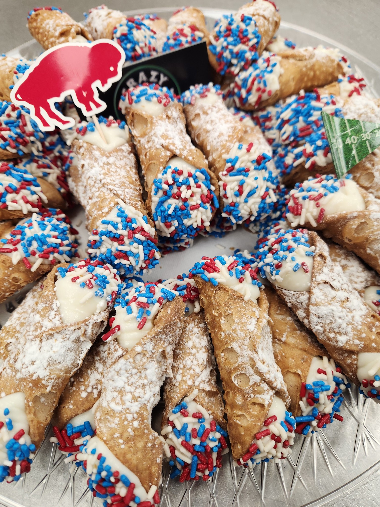 Buffalo Bills cannoli tray with red white and blue sprinkles and bison pick