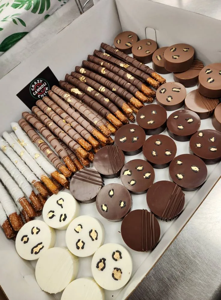 Chocolate dipped pretzels and decorated Oreos gift box